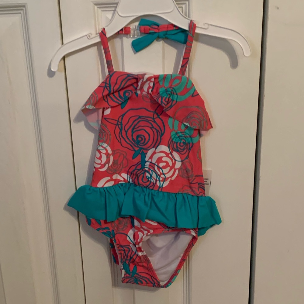 Girls infant and toddler size one piece swim suit.